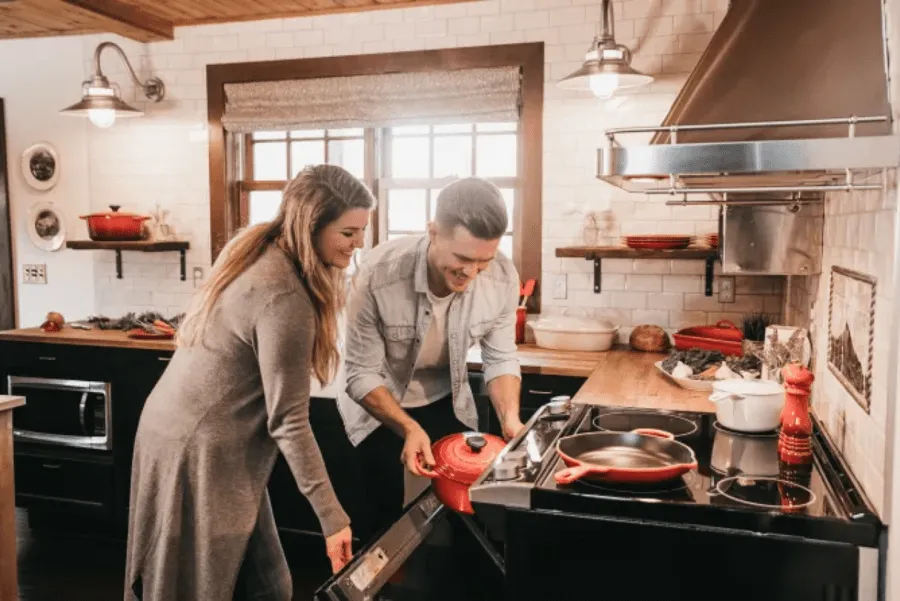 Woman and man cooking together in the kitchen.